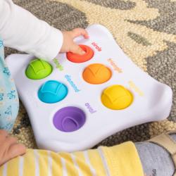 White tablet with 6 colorful buttons for children to push.